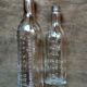 2 old graduated pharmacy bottles