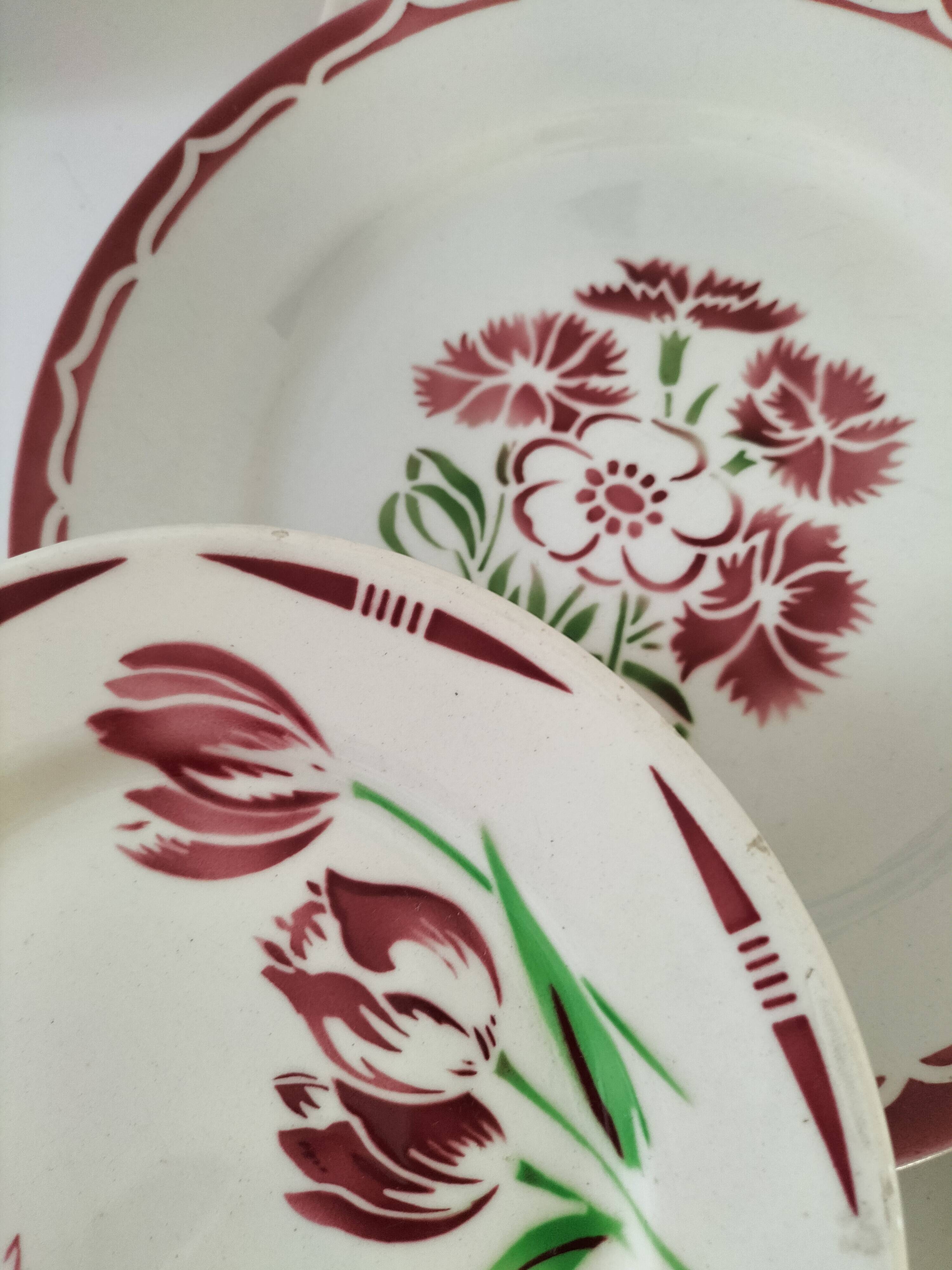 Set of 8 ironstone plates with coordinated designs.