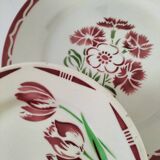 Set of 8 ironstone plates with coordinated designs.