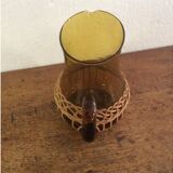 Pitcher dressed in wicker
