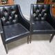 Paire de fauteuils en cuir noir, années 50