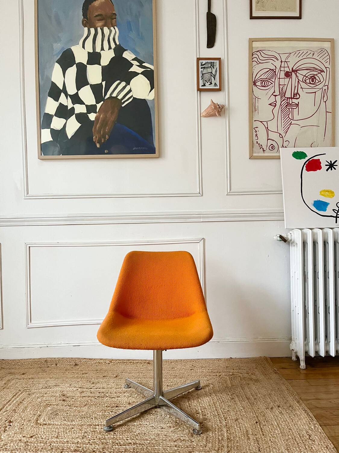 Chrome metal chair with orange fabric from the 70s.