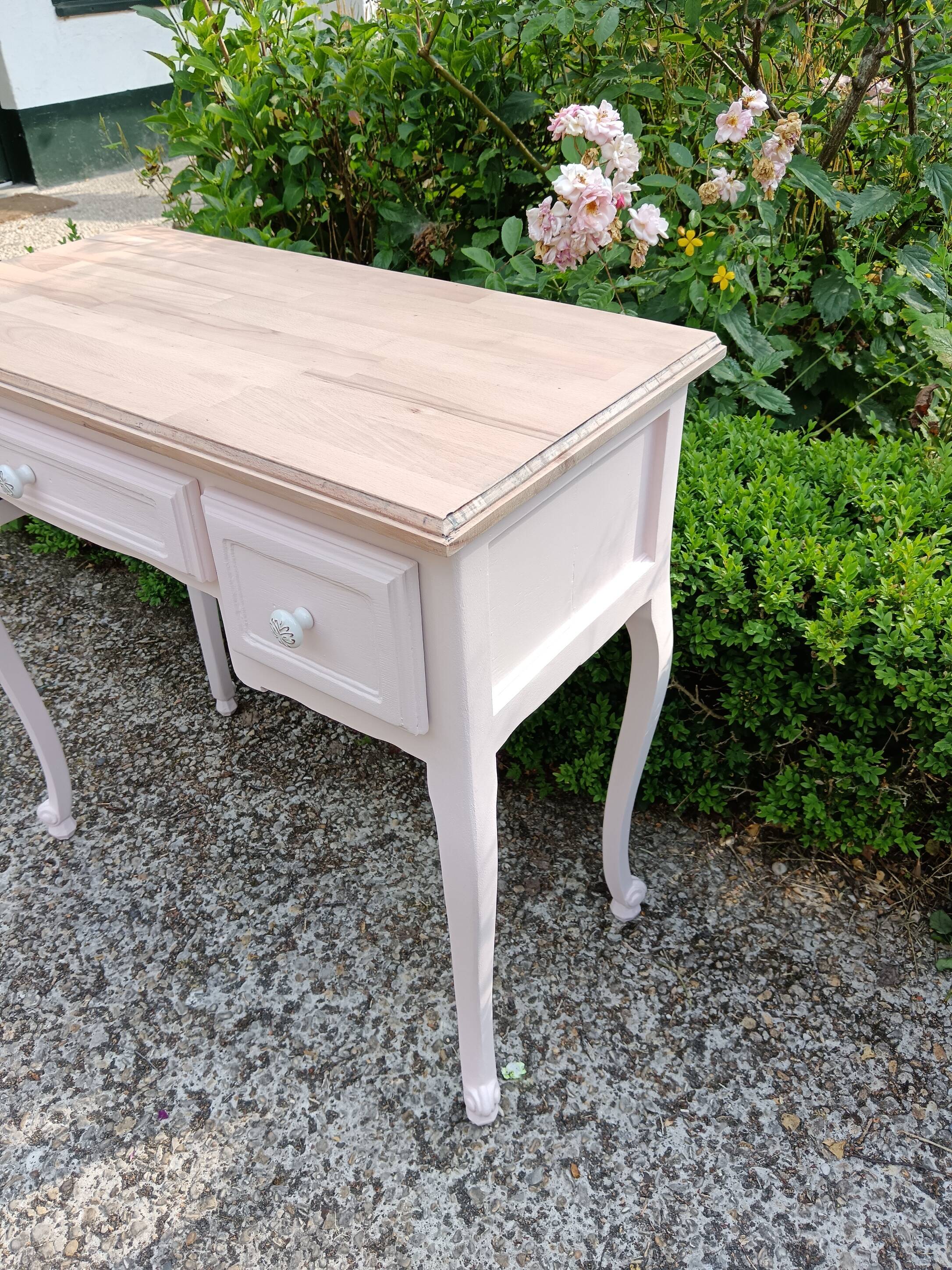 Console with 2 drawers, pink, wooden top.