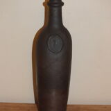 Old terracotta bottle with small spout