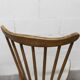 Pair of Baumann Menuet chairs, Honey patina, White skai seat