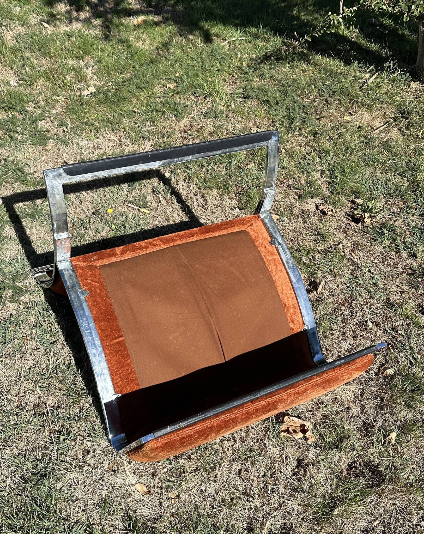 Chrome steel armchair and orange fabric by Vittorio Introini