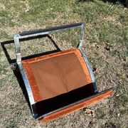 Chrome steel armchair and orange fabric by Vittorio Introini
