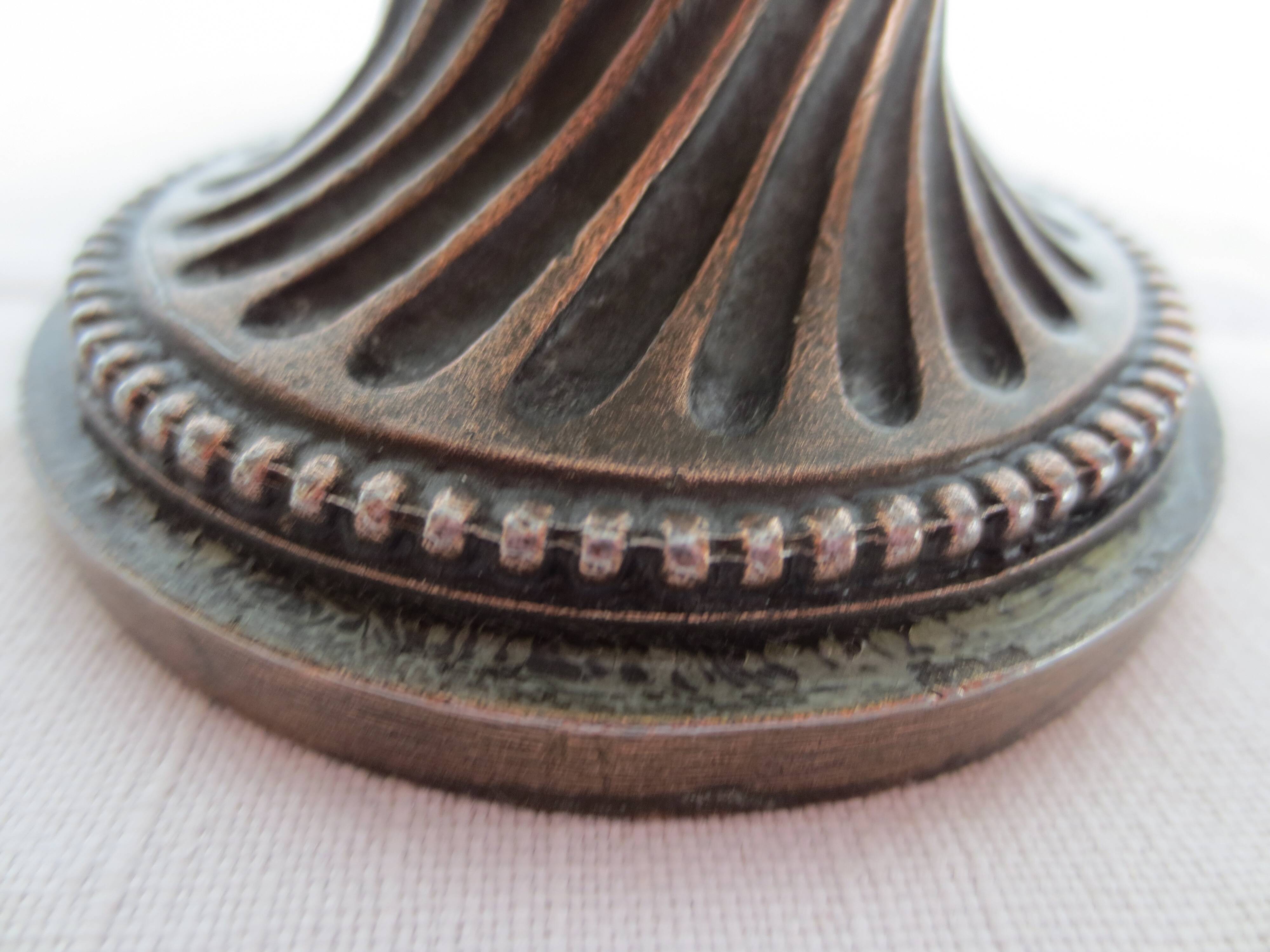Two candle holders in bronze and crystal