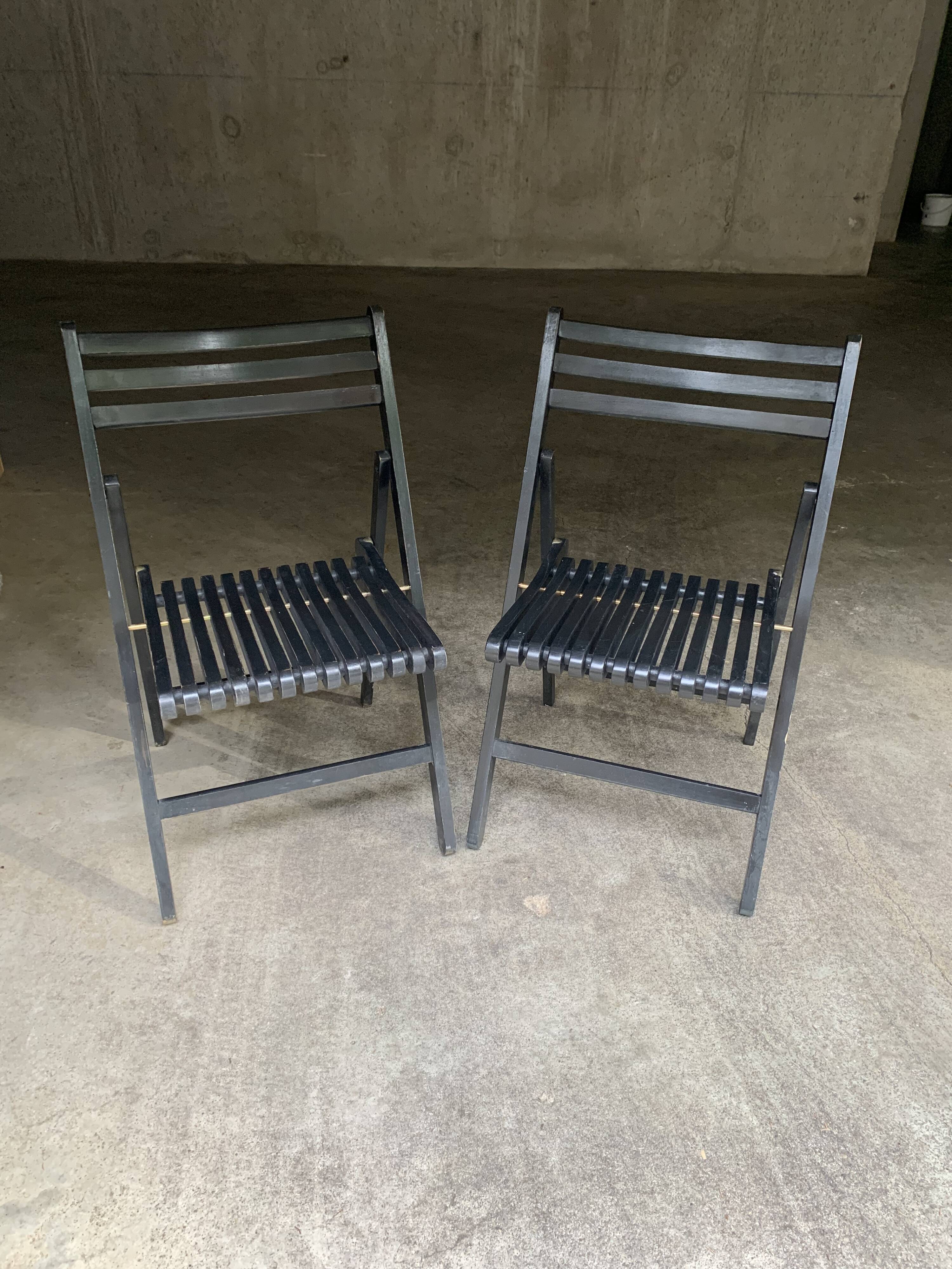 Pair of black folding chairs