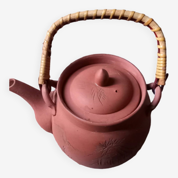 Terracotta and rattan teapot