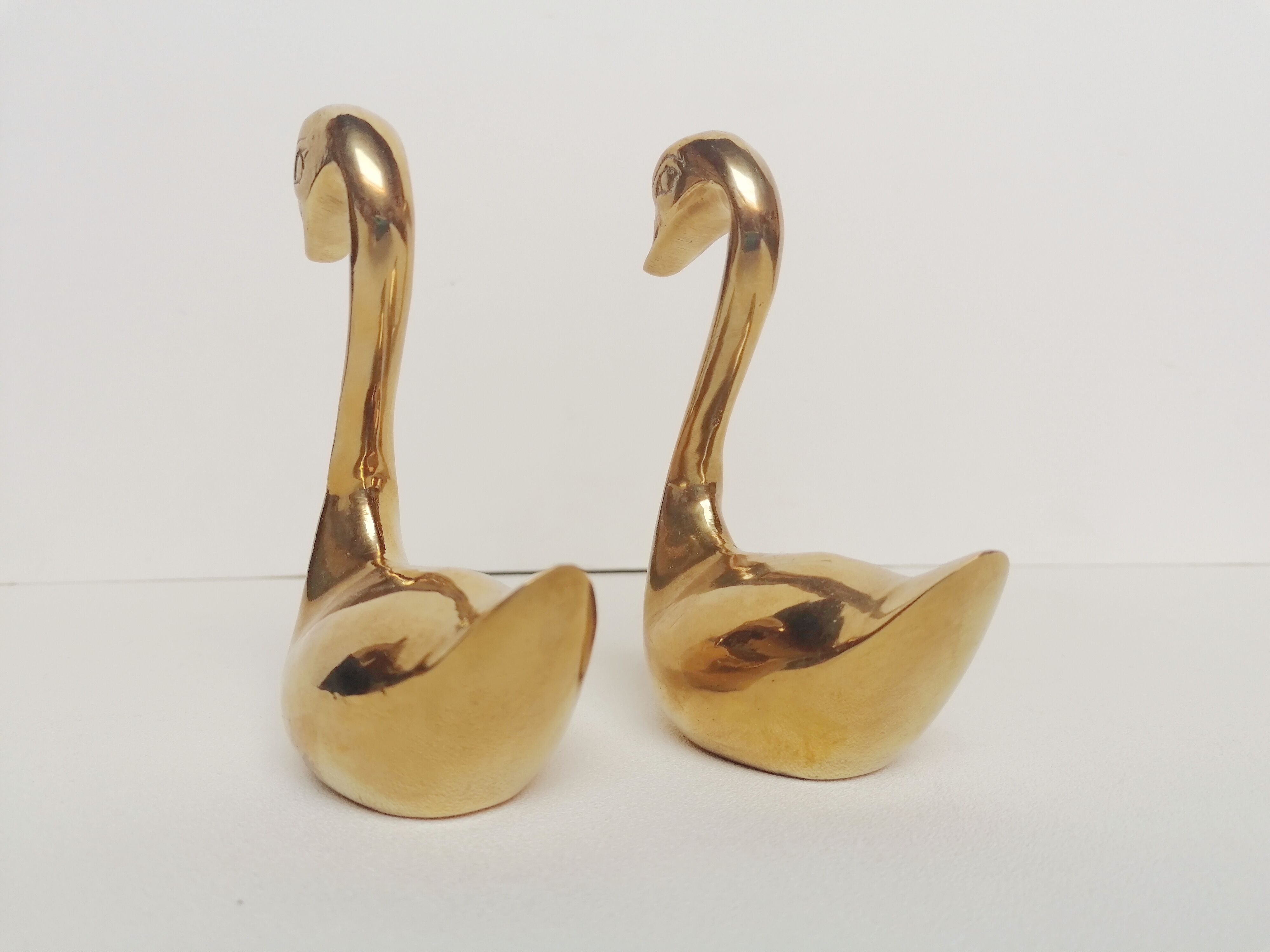 Two ducks made of solid brass