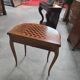 Half-moon gaming table in Louis XV style, made of precious wood marquetry.