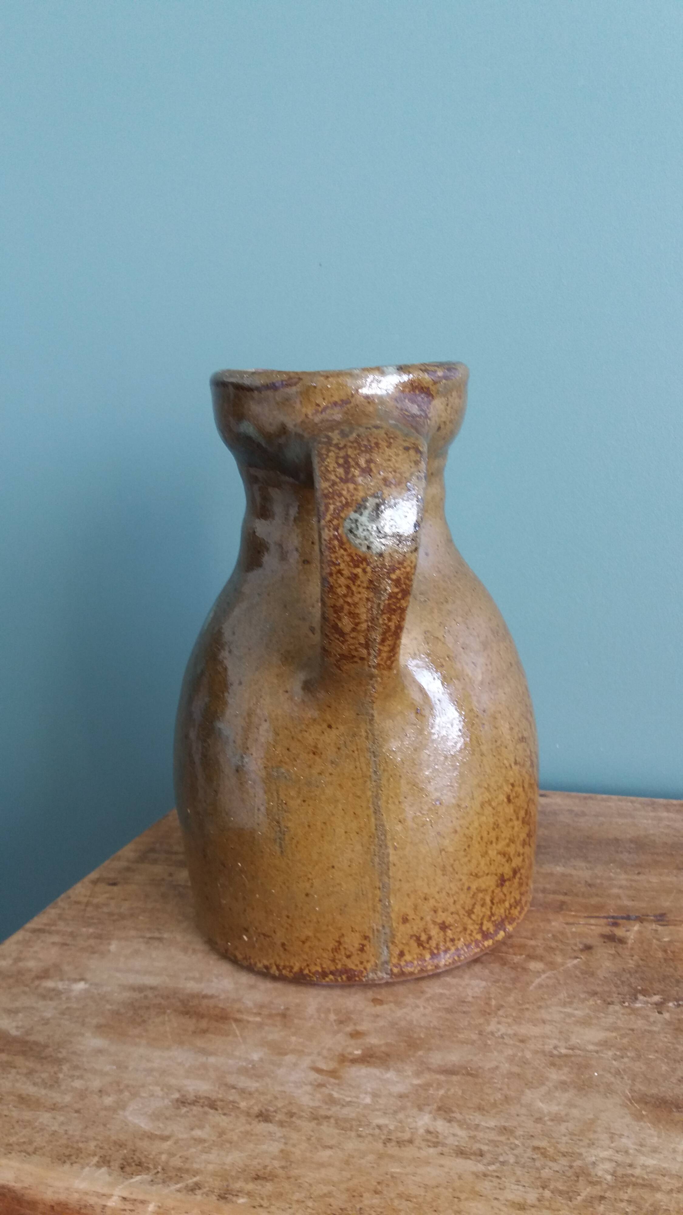 Rustic stoneware jug, chic countryside.