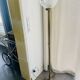 Brass floor lamp with a round glass globe