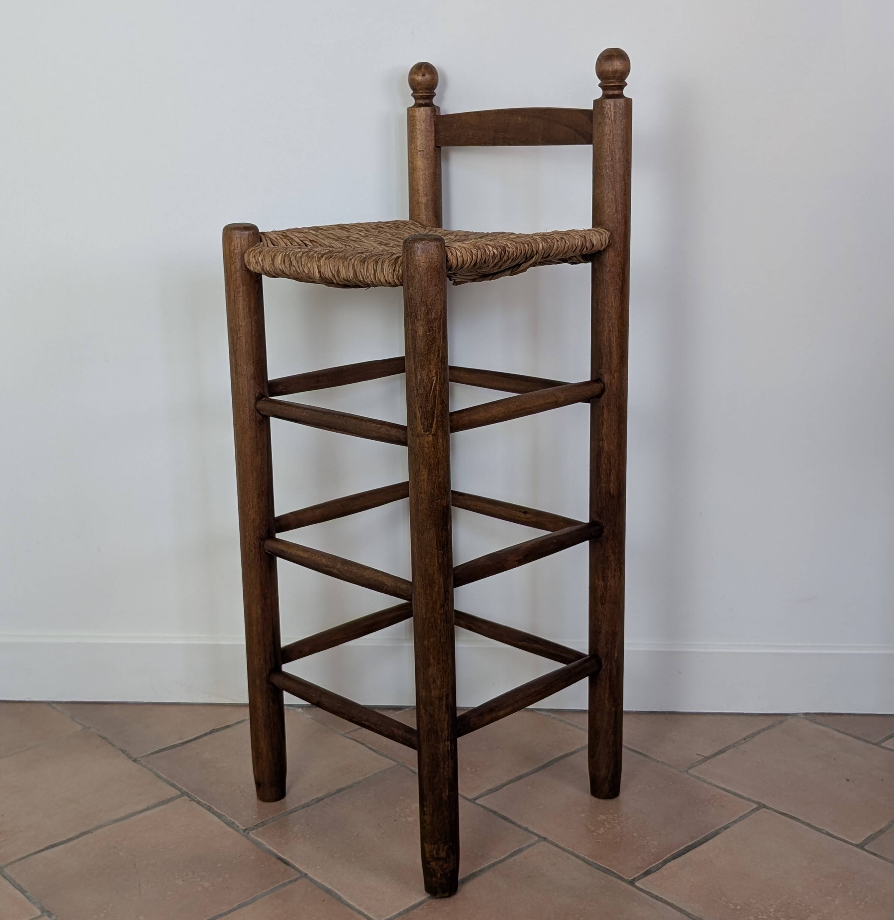 High wooden and straw stools