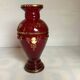 Cameo vase and red cabochons in burgundy glass
