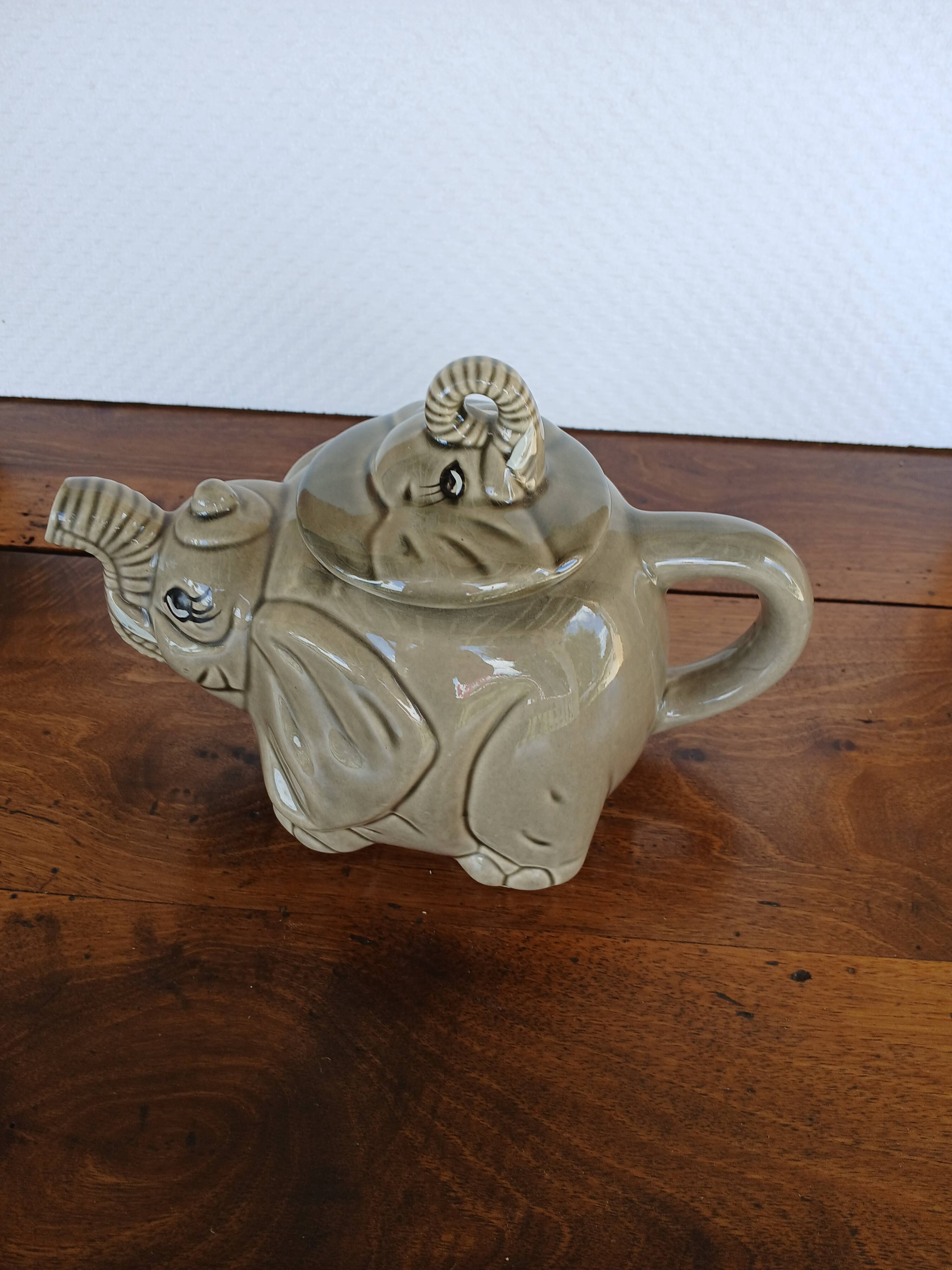 vintage ceramic teapot in the shape of a grey elephant
