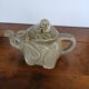 vintage ceramic teapot in the shape of a grey elephant