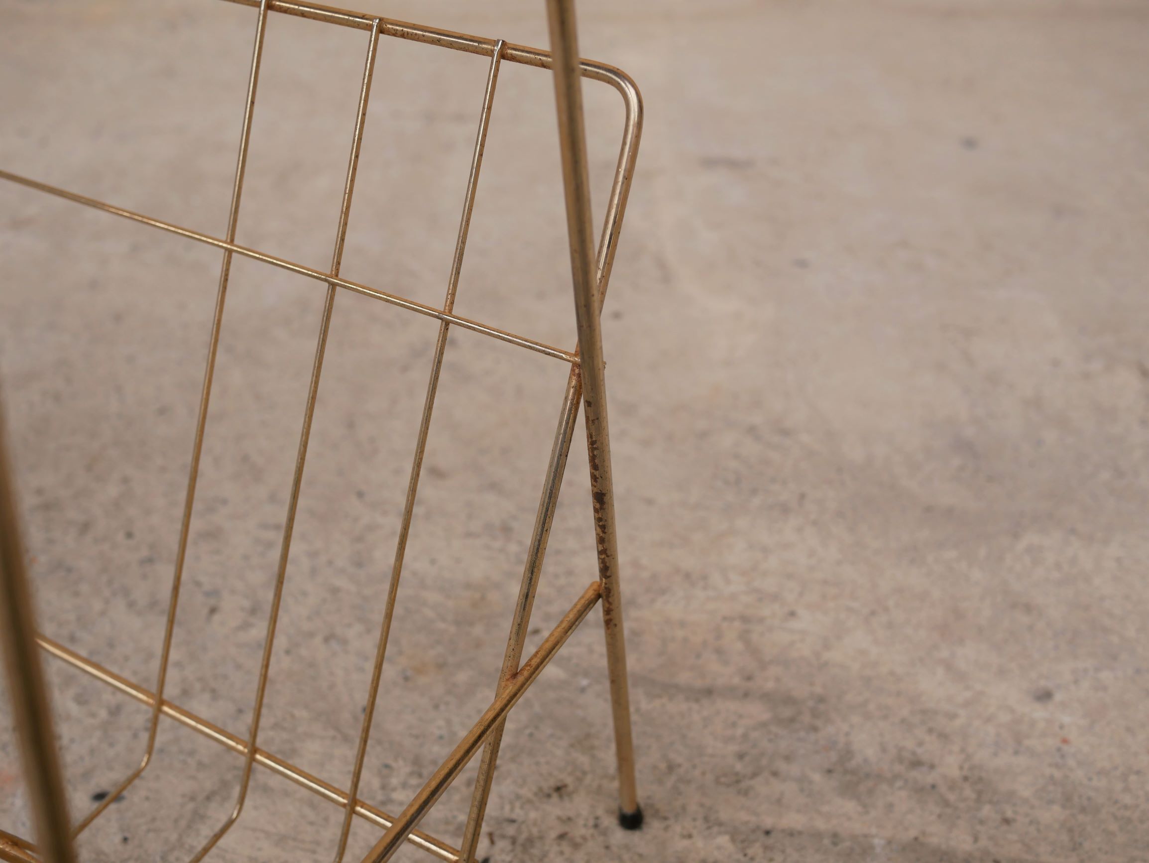 Vintage gold metal magazine rack