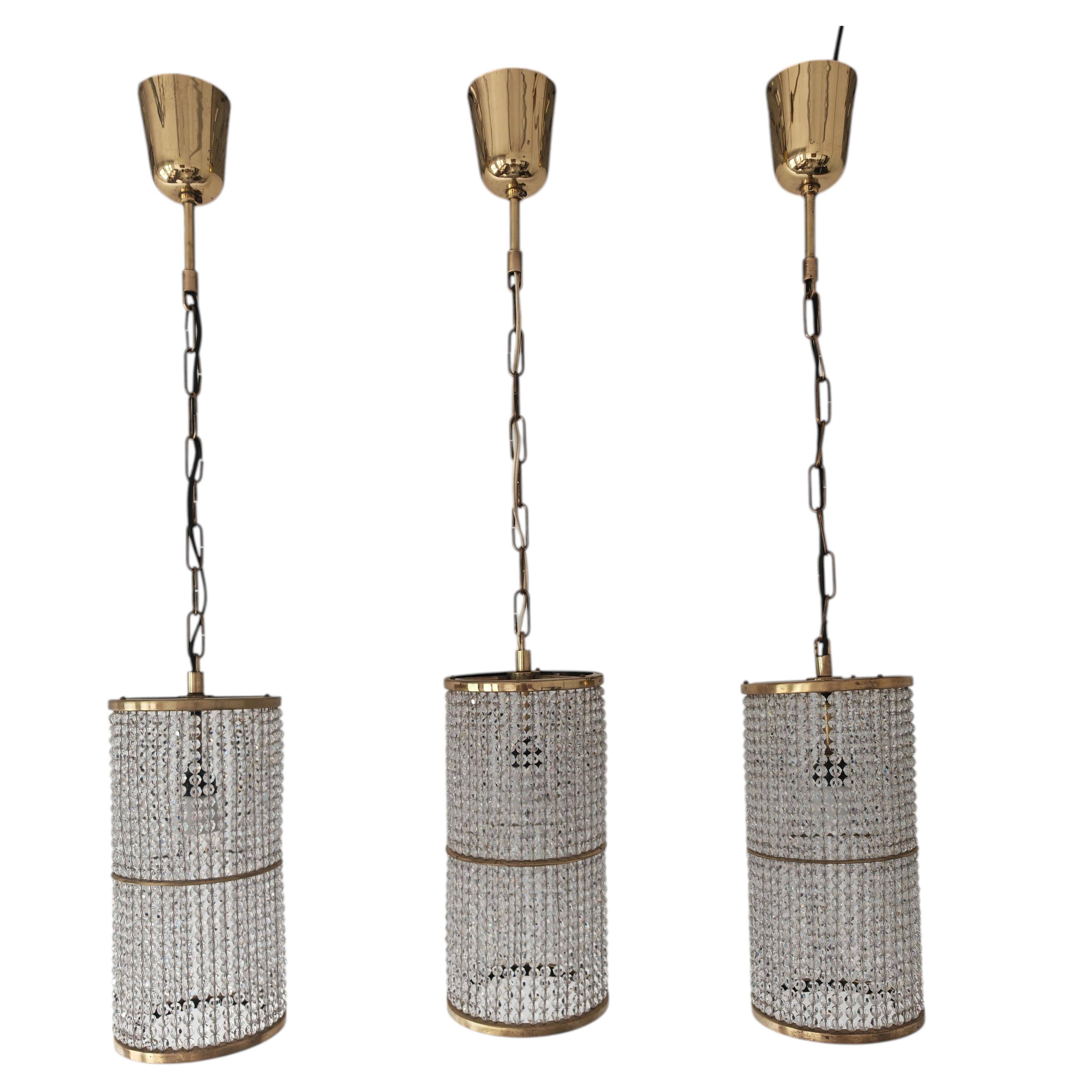 Set of 3 cylindrical crystal chandeliers in mid-century modern style attributed to Lobmeyr.