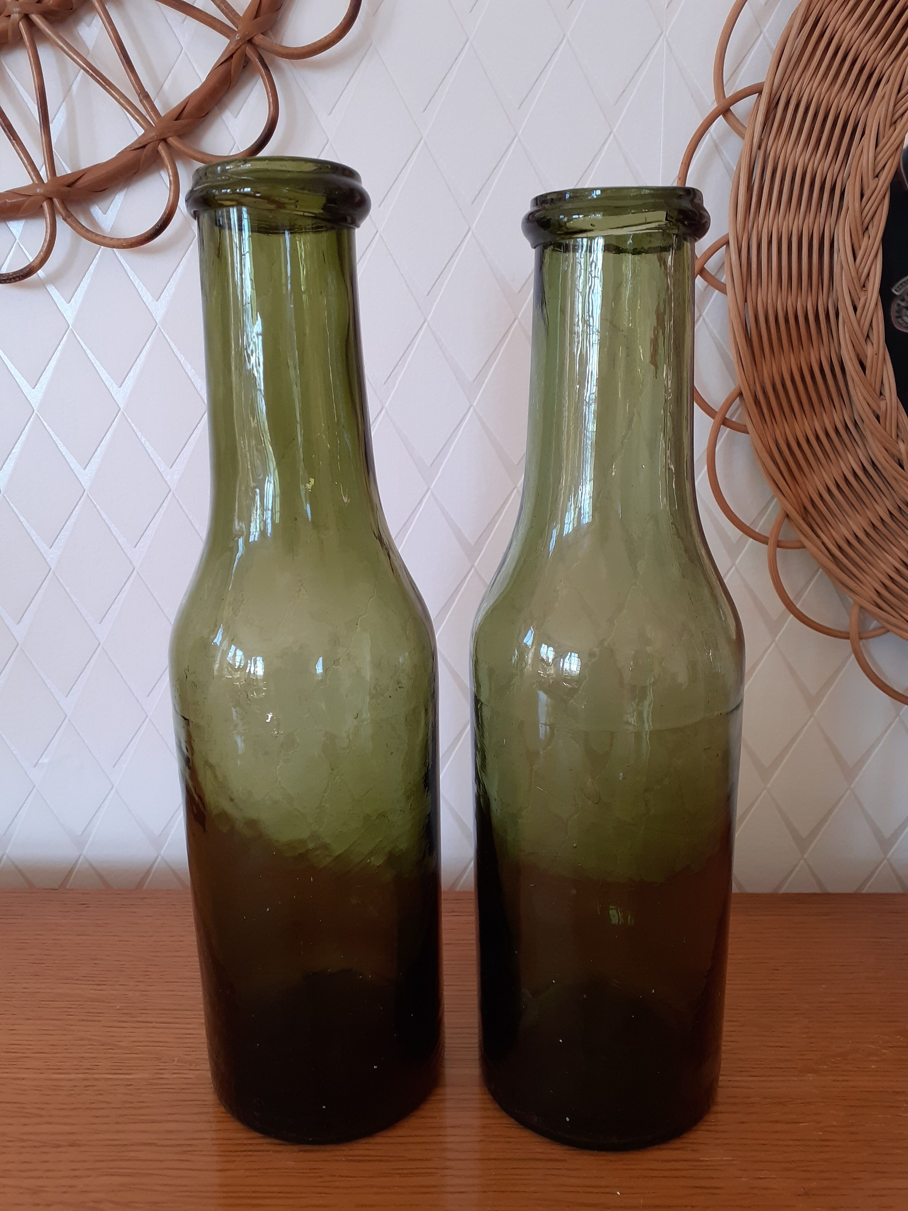Pair of green bottles made of bubbled blown glass