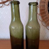 Pair of green bottles made of bubbled blown glass