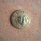 Brass sun paperweight