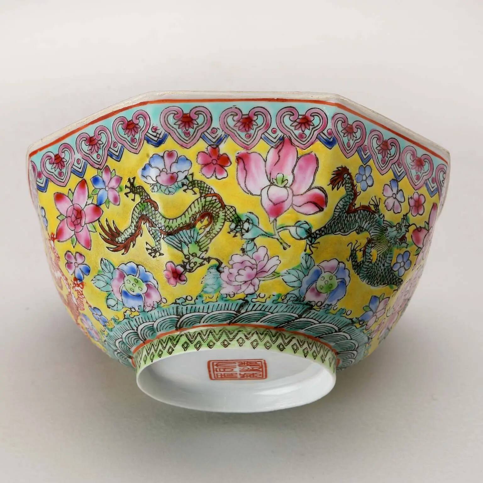Vintage porcelain bowl decorated with dragons and flowers, China, 1980s.