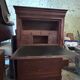 Secretary desk with mahogany and flame veneer.