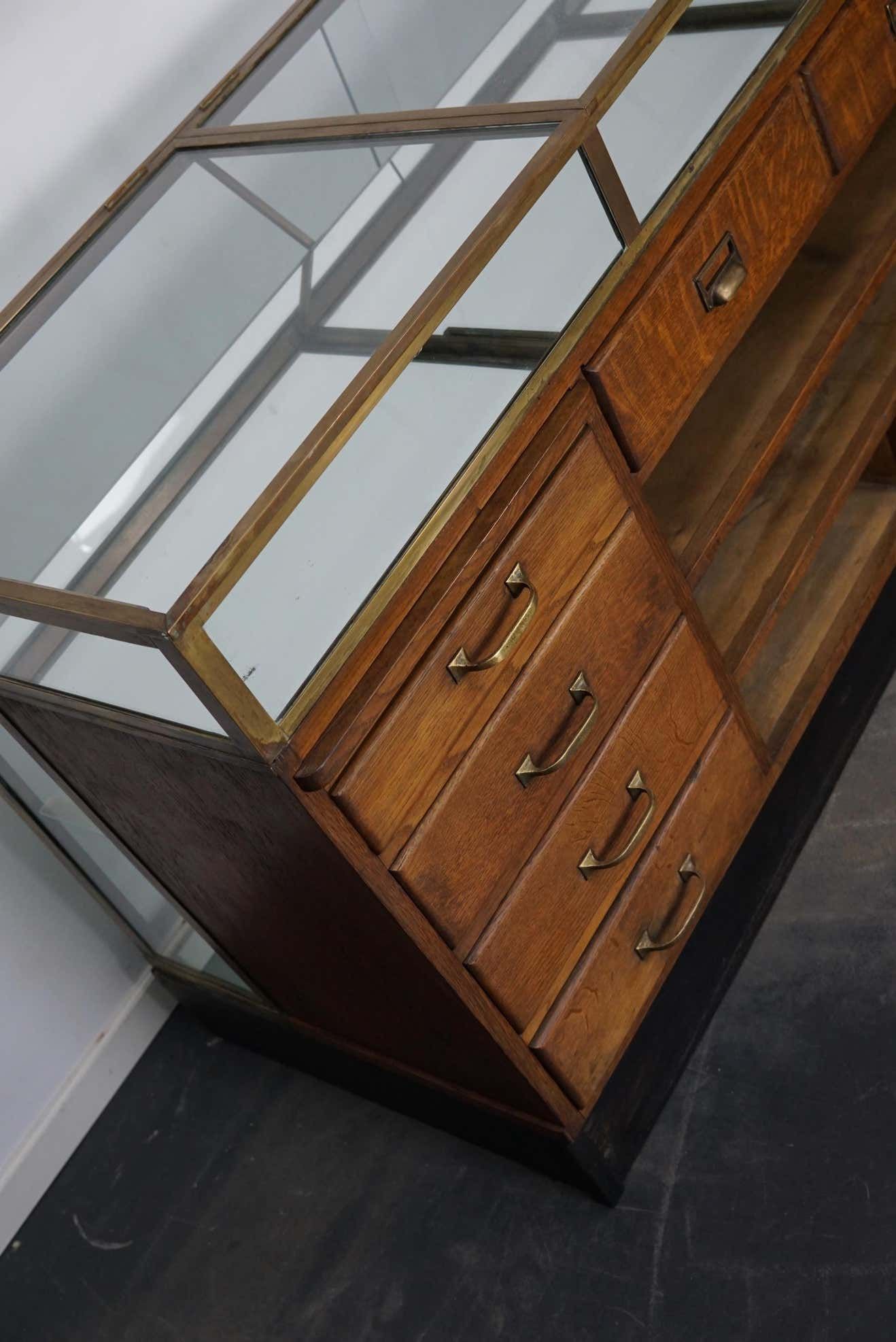 Counter or shop window in oak glass and brass France around 1920