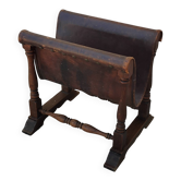 Vintage magazine rack in oak and antique leather