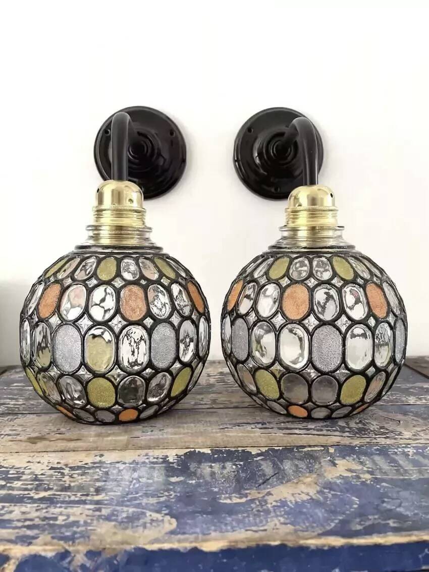 Pair of faceted glass globe wall lights