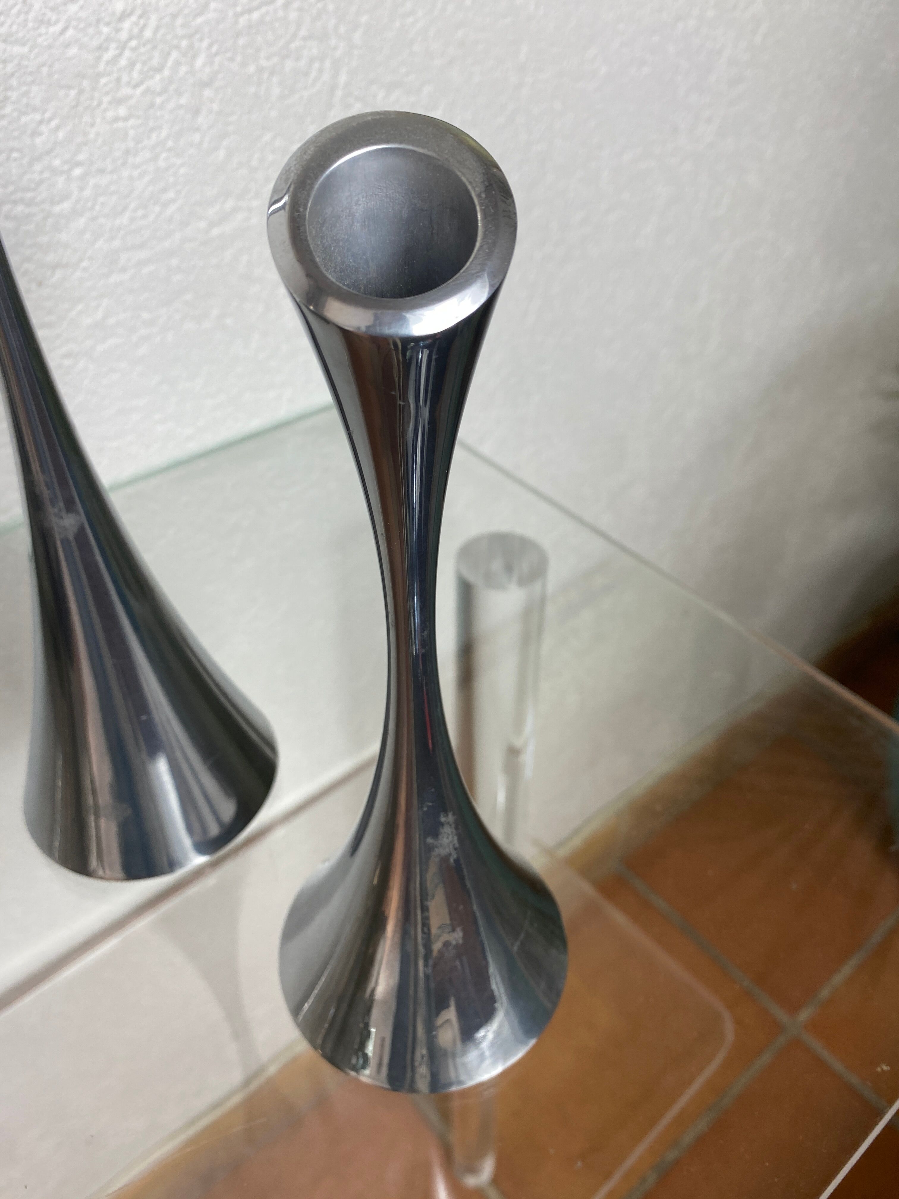Pair of designer candle holders in stainless steel