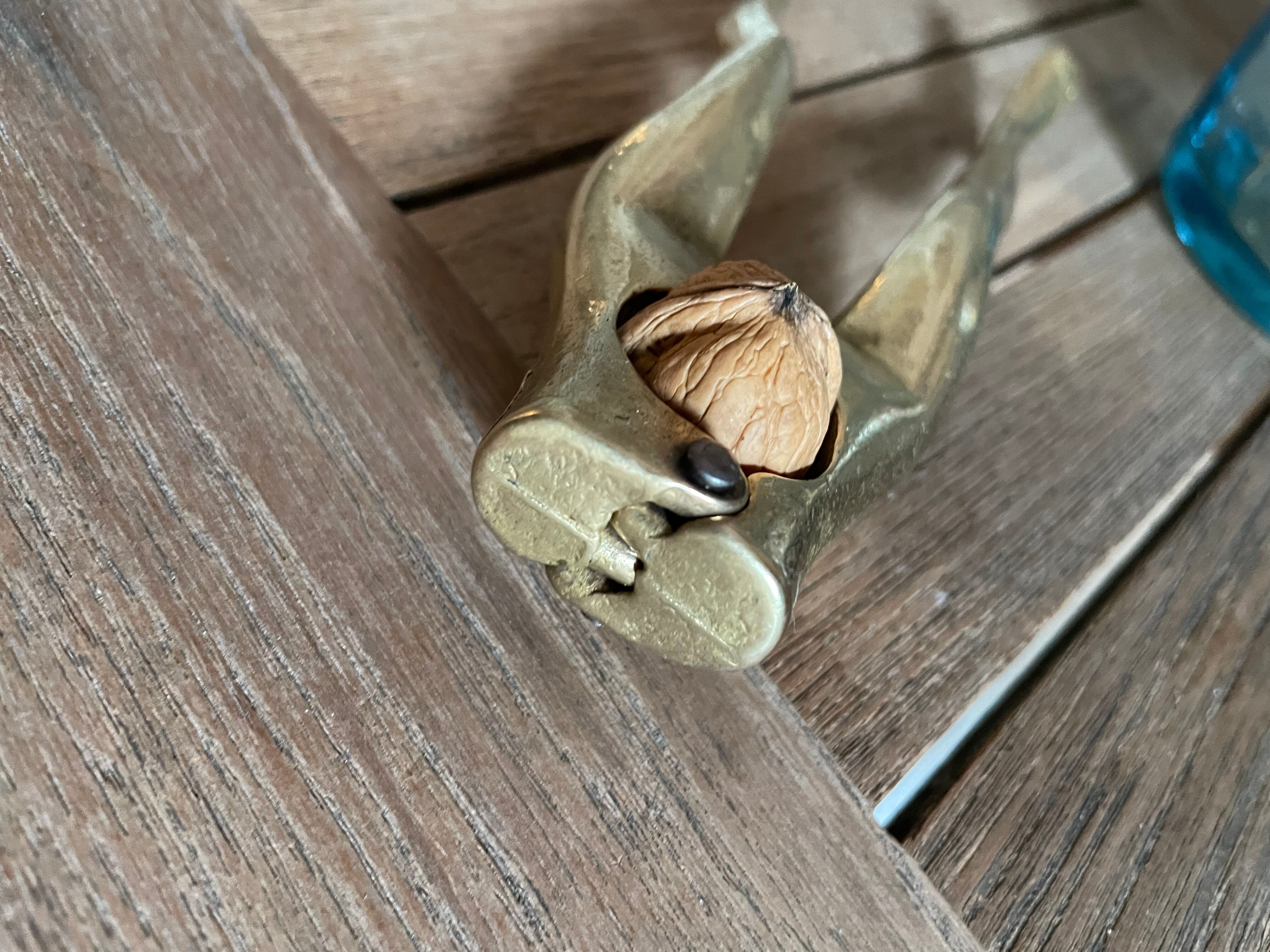 Walnut breaker in the shape of women's legs golden brass vintage