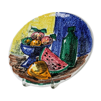 Multicolored hand-painted ceramic wall plate with 1960s Italian fruit motif, signed Stile
