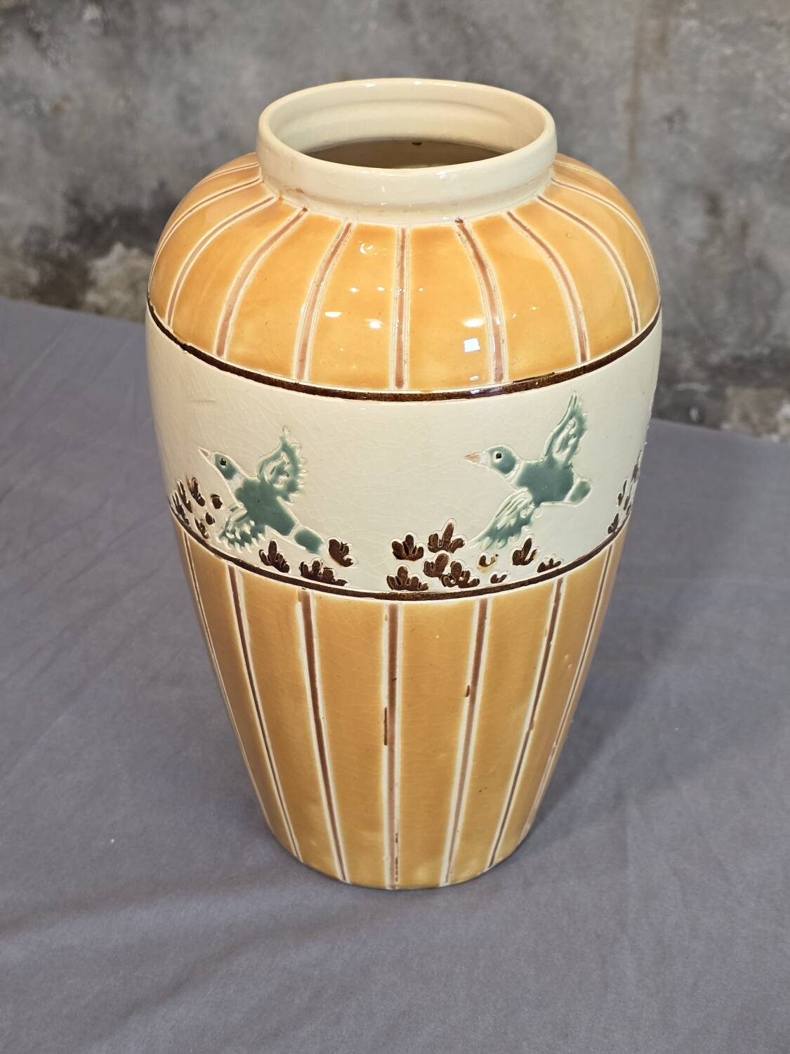 Orange and green ceramic vase with duck motif