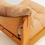 Low armchair in pine wood with bronze fabric