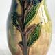 Very colorful glazed earthenware vase, old vase with floral decoration.
