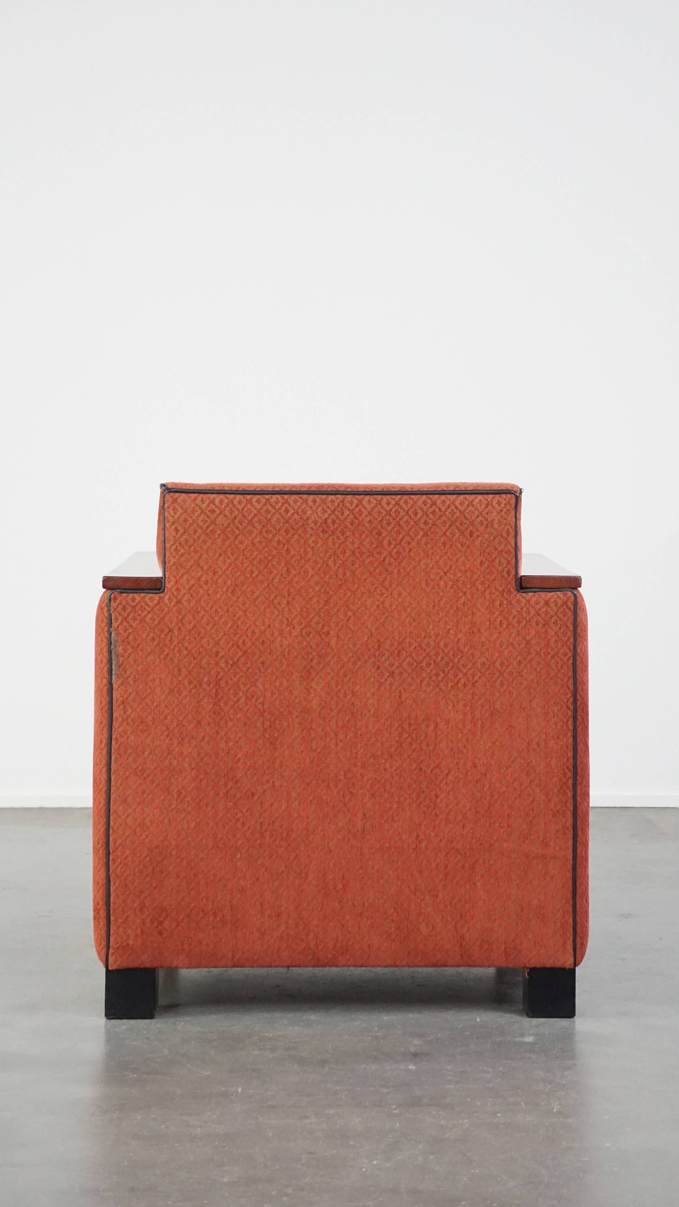 Art Deco design armchair with red fabric upholstery and wooden details