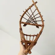 Wall-mounted plant holder in rattan