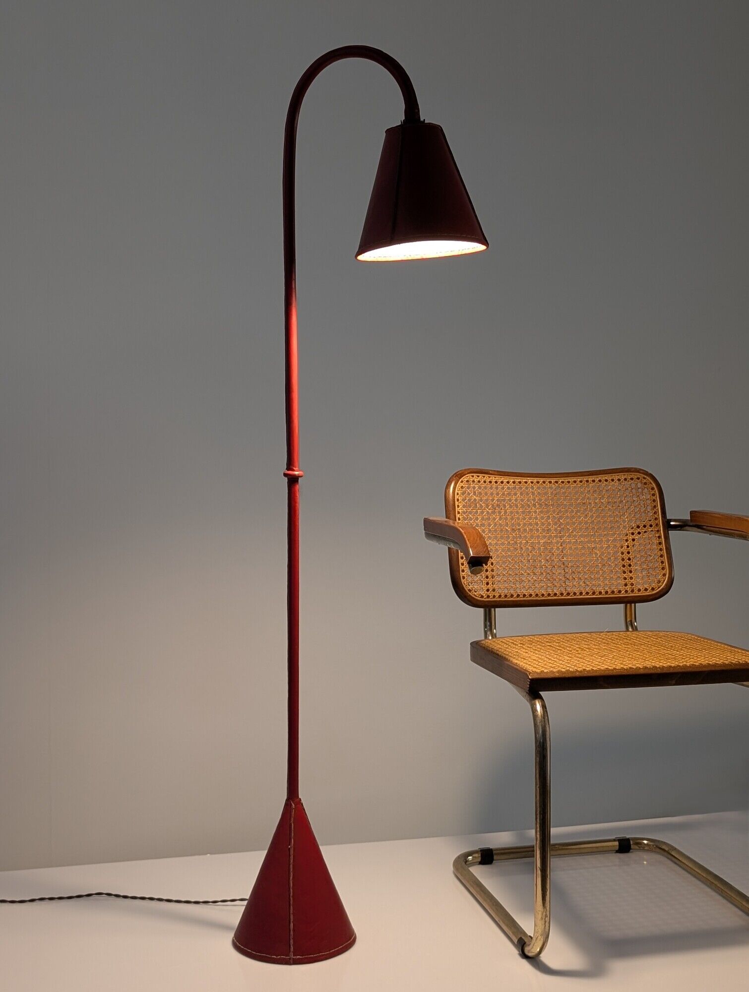 Jacques Adnet floor lamp in red leather, mid-century modern, France, 1960s