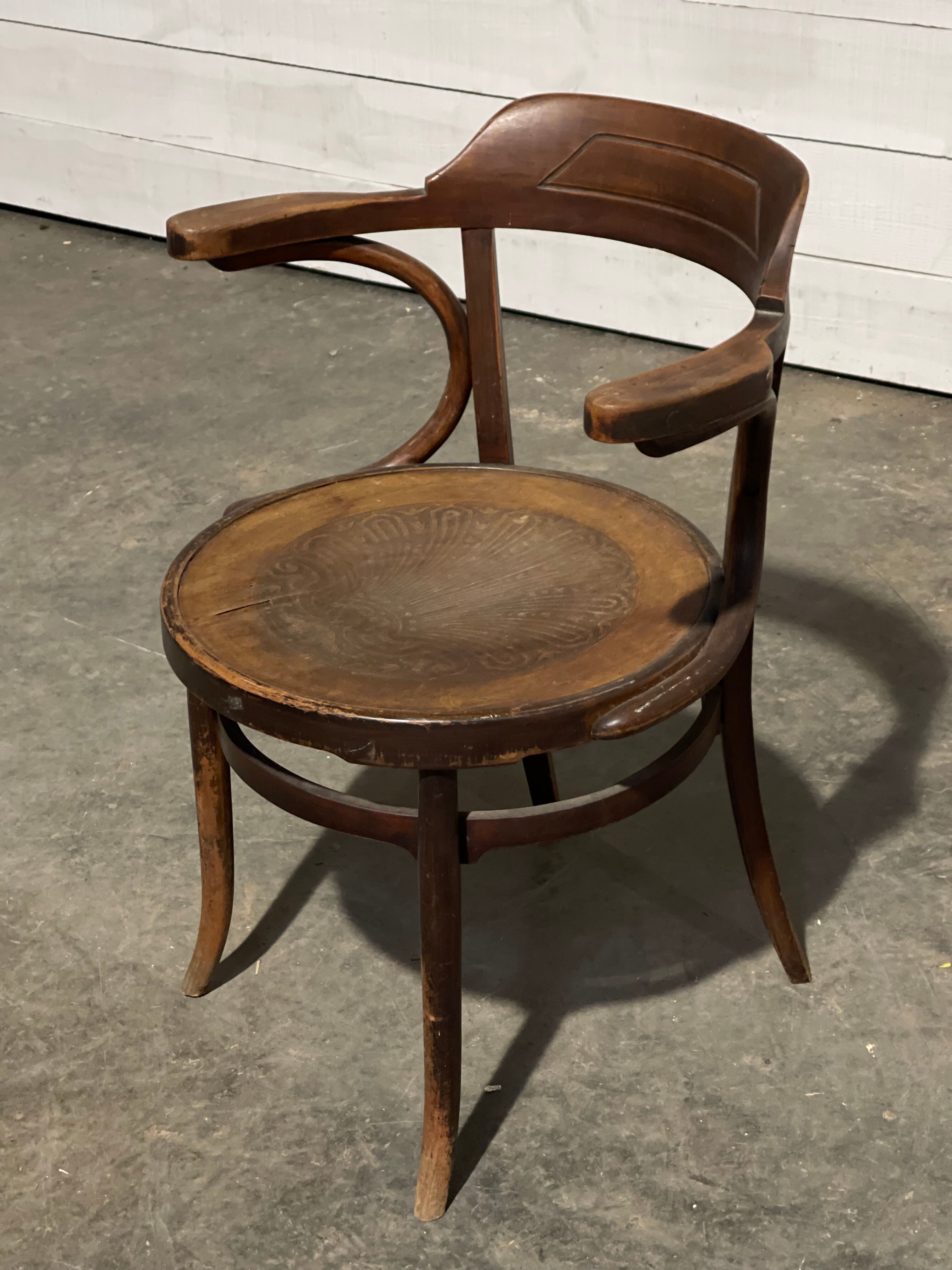 Curved wooden armchair