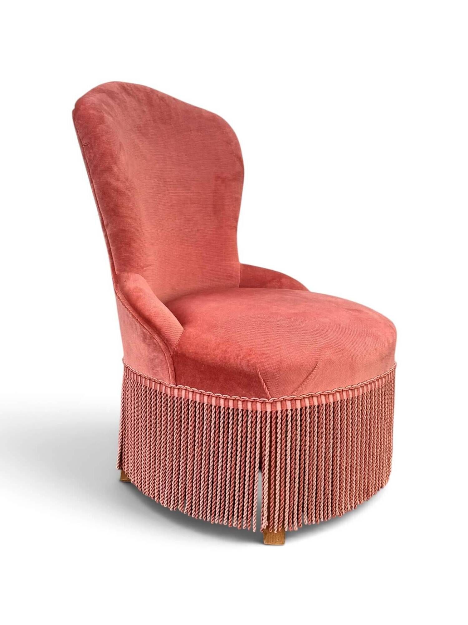 Vintage pink velvet fringed armchair