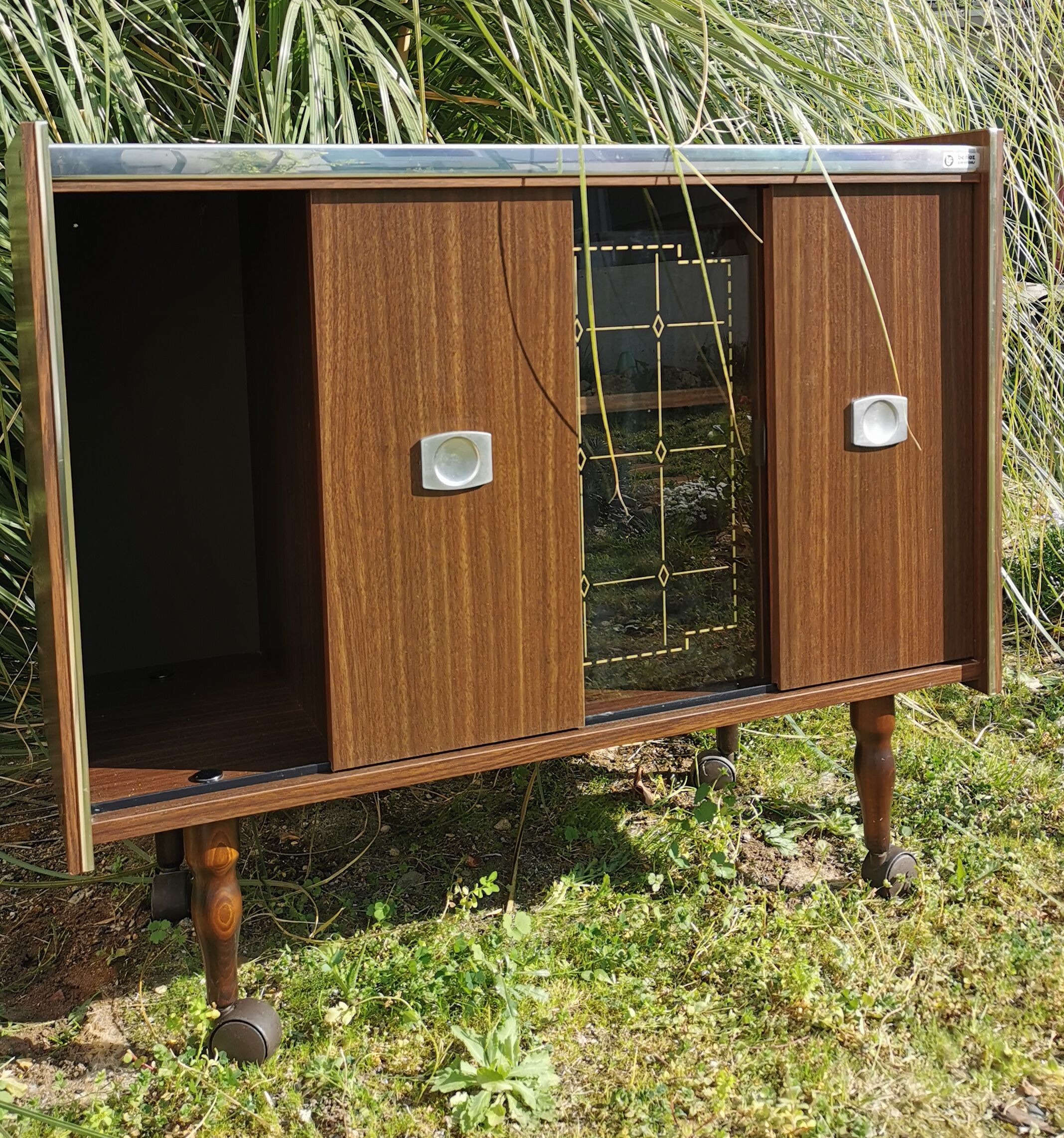 Furniture bar showcase with vintage wheels