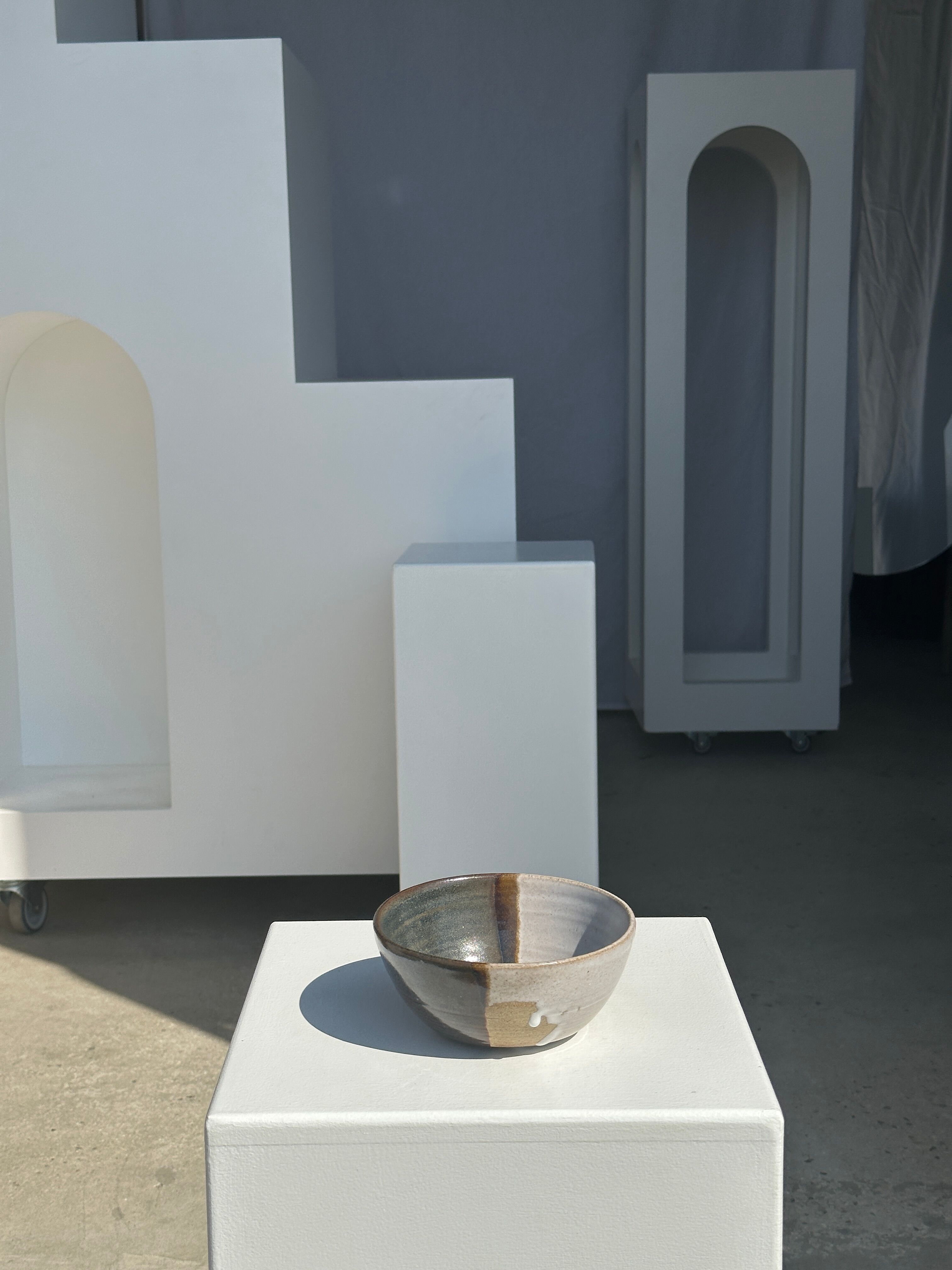 White and glossy brown two-tone ceramic bowl, matt earth