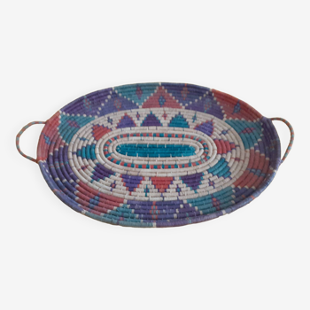flat basket with 2 handles. Ethnic in multicolored straw.