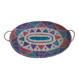 flat basket with 2 handles. Ethnic in multicolored straw.