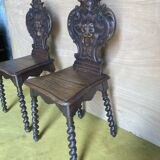 Duo of carved wooden chairs