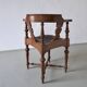Fauteuil d'angle ancien sculpté avec assise en cuir