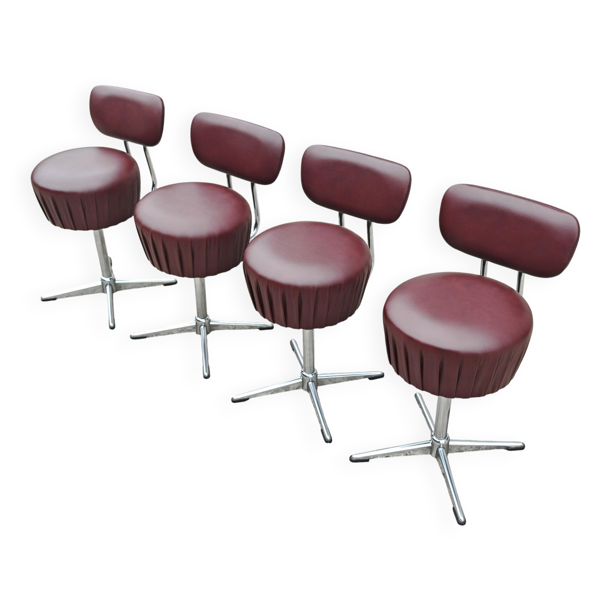 Set of 4 Mid Century Modern swivel chairs in tubular steel and leather.